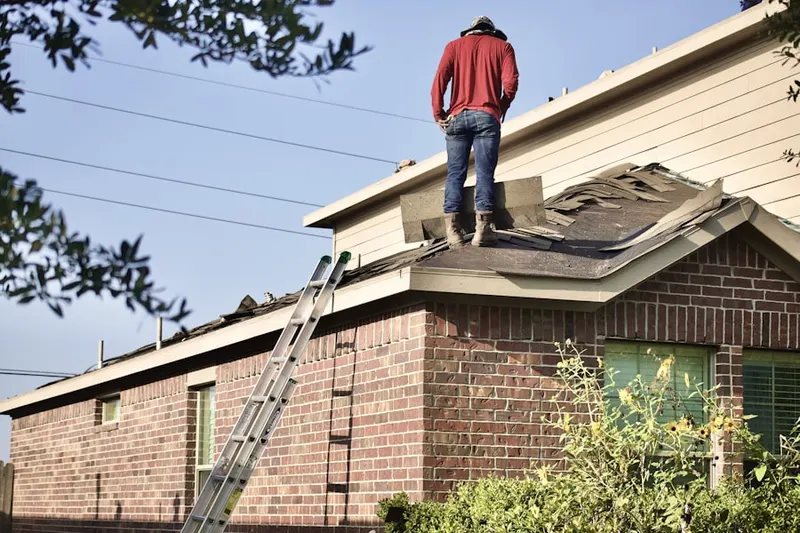 Professional roofer working on a residential roof in Desert Center